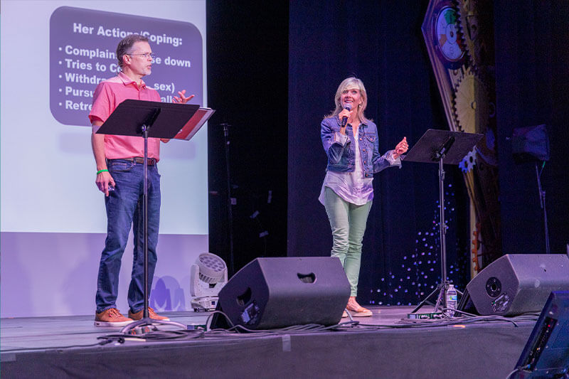 Ron and Nan Deal on stage at a conference